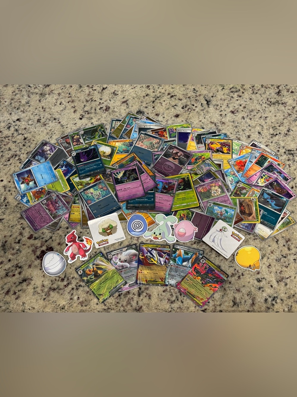 Bundle of 120 Assorted Pokémon Card Lot with Stickers and Tin
